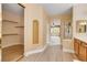 Bathroom with a shower, vanity, double sinks, and natural lighting at 812 Eaglewood Dr, Las Vegas, NV 89144
