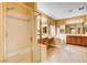 Bathroom includes shower, tub, double sinks, and warm lighting at 812 Eaglewood Dr, Las Vegas, NV 89144