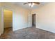 Bedroom with carpeted floors, ceiling fan, and walk in closet at 812 Eaglewood Dr, Las Vegas, NV 89144