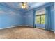 Whimsical bedroom with blue sky mural and cozy carpet at 812 Eaglewood Dr, Las Vegas, NV 89144
