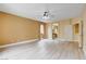 Large bedroom with light wood floors, neutral walls, ceiling fan, and bath access at 812 Eaglewood Dr, Las Vegas, NV 89144