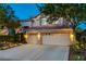 Charming two-story home featuring a three-car garage and a beautifully landscaped front yard at 812 Eaglewood Dr, Las Vegas, NV 89144
