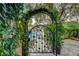 Beautifully designed wrought iron gate providing access to the front yard and lush landscaping at 812 Eaglewood Dr, Las Vegas, NV 89144