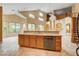 Large kitchen island with sink, dishwasher, and tile flooring at 812 Eaglewood Dr, Las Vegas, NV 89144