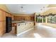 Well-lit kitchen featuring ample cabinetry, granite countertops, modern appliances, and an eat-in bar at 812 Eaglewood Dr, Las Vegas, NV 89144
