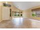 Spacious living room with large windows and tile flooring at 812 Eaglewood Dr, Las Vegas, NV 89144