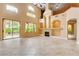 Bright living room with gas fireplace, tile floors, and a sliding glass door that leads to the backyard at 812 Eaglewood Dr, Las Vegas, NV 89144