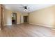 Large living room with arched entryway, wood floors, ceiling fan at 812 Eaglewood Dr, Las Vegas, NV 89144