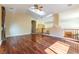 Open-concept living room with hardwood floors, a ceiling fan, and stairs leading to the second floor at 812 Eaglewood Dr, Las Vegas, NV 89144