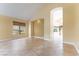 Spacious living room with neutral paint and flooring, as well as an archway leading to other rooms at 812 Eaglewood Dr, Las Vegas, NV 89144