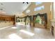 Expansive living area with high ceilings, large windows, and an open layout connecting to the kitchen at 812 Eaglewood Dr, Las Vegas, NV 89144