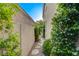 Landscaped side yard with stone walkway between homes, creating a charming outdoor path at 812 Eaglewood Dr, Las Vegas, NV 89144