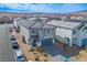 View of a two-story home with a gray tile roof in a residential neighborhood at 9871 Magnus Ct, Las Vegas, NV 89178