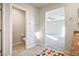 Bright bathroom featuring tile flooring and an attached toilet room at 9871 Magnus Ct, Las Vegas, NV 89178