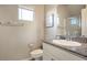 Bathroom featuring a granite countertop, modern fixtures, and a shower with glass door at 9871 Magnus Ct, Las Vegas, NV 89178