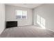 Comfortable bedroom with neutral carpeting and a window providing natural light, perfect for relaxation and rest at 9871 Magnus Ct, Las Vegas, NV 89178