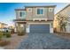 Charming two-story home features a two-car garage and well-maintained landscaping at 9871 Magnus Ct, Las Vegas, NV 89178