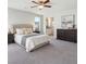 Serene main bedroom featuring plush carpet, an ensuite bathroom, and ample space for relaxation at 9871 Magnus Ct, Las Vegas, NV 89178
