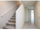 Carpeted staircase leading to the upper level, offering a seamless transition between floors at 9871 Magnus Ct, Las Vegas, NV 89178
