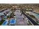 An aerial perspective of a lovely community with swimming pools, roads, and nearby city amenities at 10048 Copper Edge Rd, Las Vegas, NV 89148