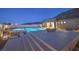 Modern backyard pool with city views, built-in hot tub and a fire pit at 10048 Copper Edge Rd, Las Vegas, NV 89148