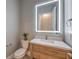 Chic powder room with a custom vanity, stylish mirror, and contemporary fixtures at 10048 Copper Edge Rd, Las Vegas, NV 89148