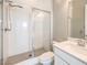 Bathroom featuring shower with glass door, single sink, and updated fixtures at 10048 Copper Edge Rd, Las Vegas, NV 89148
