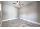 Corner bedroom with herringbone floors, neutral walls, and base trim at 10048 Copper Edge Rd, Las Vegas, NV 89148