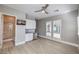 Bright bedroom featuring a wet bar, neutral walls, and ceiling fan at 10048 Copper Edge Rd, Las Vegas, NV 89148