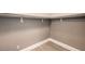 Neutral closet features upper shelving and a simple design with modern vinyl flooring at 10048 Copper Edge Rd, Las Vegas, NV 89148
