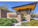 Onyx Point community entrance with stone architecture and manicured shrubs at 10048 Copper Edge Rd, Las Vegas, NV 89148