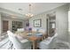 Elegant dining room features a large wood table and contemporary chandelier at 10048 Copper Edge Rd, Las Vegas, NV 89148