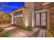Inviting front entrance with stylish double doors, stone accents, and professional landscaping at 10048 Copper Edge Rd, Las Vegas, NV 89148