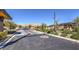 Well-manicured gated entrance with modern design and lush greenery at 10048 Copper Edge Rd, Las Vegas, NV 89148