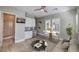 Bright living room features a wet bar, a comfortable sofa, and an attached bathroom at 10048 Copper Edge Rd, Las Vegas, NV 89148
