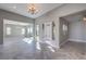 Spacious open-plan living area featuring modern floors and abundant natural light at 10048 Copper Edge Rd, Las Vegas, NV 89148