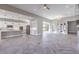 Open-concept living space featuring herringbone floors, a kitchen, and dining area at 10048 Copper Edge Rd, Las Vegas, NV 89148