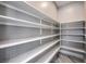 Walk-in pantry with ample shelving, perfect for organized storage at 10048 Copper Edge Rd, Las Vegas, NV 89148