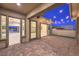 Covered patio with brick flooring, string lights, and access to the home at 10048 Copper Edge Rd, Las Vegas, NV 89148