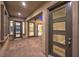 Covered patio boasts tiled floors, modern doors and windows, and ample natural light at 10048 Copper Edge Rd, Las Vegas, NV 89148