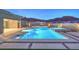 Inviting backyard pool and spa area with modern design and beautiful landscaping at 10048 Copper Edge Rd, Las Vegas, NV 89148