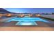 Backyard swimming pool and hot tub with modern design and lighting at 10048 Copper Edge Rd, Las Vegas, NV 89148