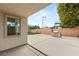 Backyard area with an artificial lawn, a brick perimeter wall, and a built-in grill at 10501 Haywood Dr, Las Vegas, NV 89135
