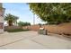 Large backyard with concrete patio, built-in grill, artificial turf and brick privacy wall at 10501 Haywood Dr, Las Vegas, NV 89135