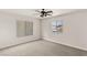 This bedroom features two large windows with blinds and neutral carpeting at 10501 Haywood Dr, Las Vegas, NV 89135