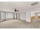 Spacious bonus room with neutral walls, carpet, ceiling fan, and bright windows at 10501 Haywood Dr, Las Vegas, NV 89135