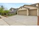 Wide driveway leading to a three-car garage, providing ample parking space at 10501 Haywood Dr, Las Vegas, NV 89135