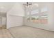Bright living room with carpet flooring, large windows and high ceilings at 10501 Haywood Dr, Las Vegas, NV 89135