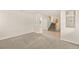 Bright living room with neutral carpeting and an open view to the staircase at 10501 Haywood Dr, Las Vegas, NV 89135