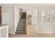 View of the carpeted staircase, tile flooring, and open floorplan layout at 10501 Haywood Dr, Las Vegas, NV 89135